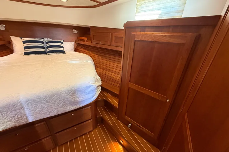 Slide: The Image of Luxurious cabin interior of 2017 Sabre 38 Salon Express with wooden finish and cozy bedding. - 55