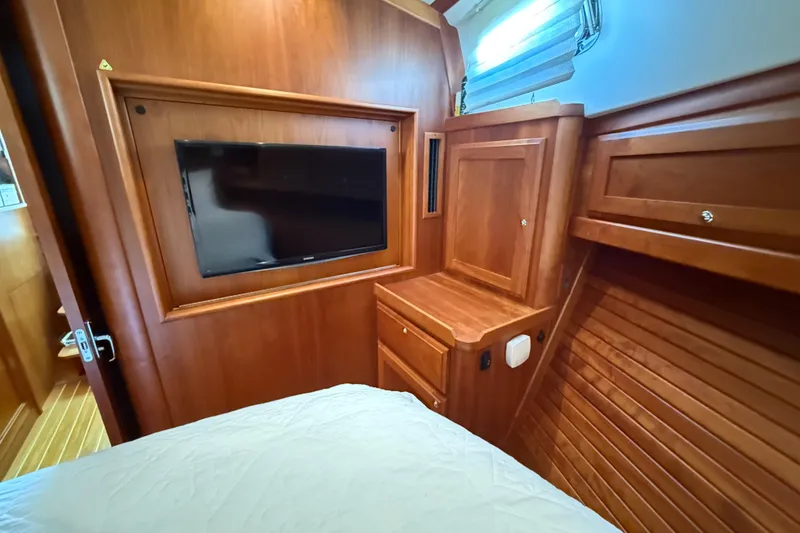 Slide: The Image of Luxurious wood interior of 2017 Sabre 38 Salon Express with mounted TV and cabinetry. - 58