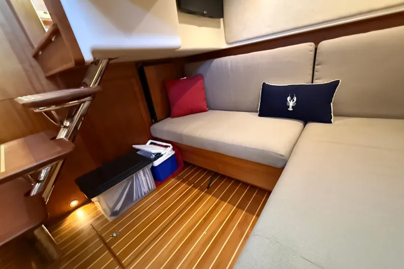 Slide: The Image of Interior of 2017 Sabre 38 Salon Express with cozy seating and nautical decor. - 69