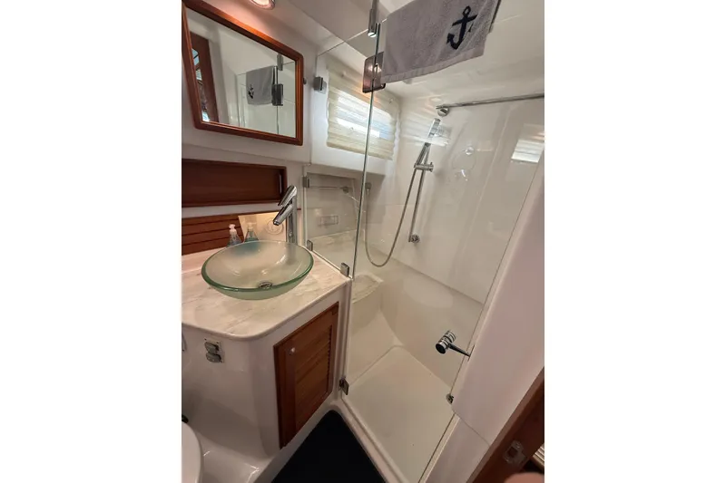 Slide: The Image of Luxurious bathroom in 2017 Sabre 38 Salon Express yacht with glass sink and shower. - 72