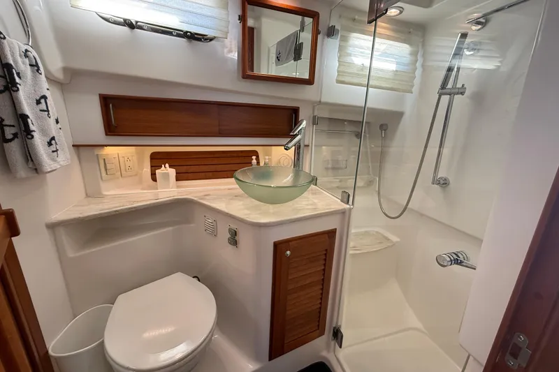 Slide: The Image of Luxurious bathroom in 2017 Sabre 38 Salon Express yacht with glass sink and shower. - 73