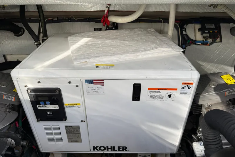 Slide: The Image of Engine room of 2017 Sabre 38 Salon Express featuring a Kohler generator. - 79