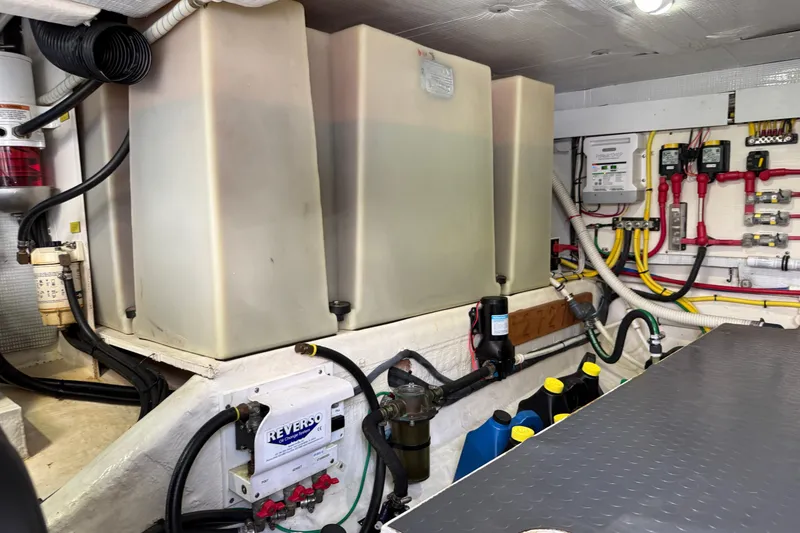 Slide: The Image of Engine room of 2017 Sabre 38 Salon Express with fuel tanks and wiring. - 81