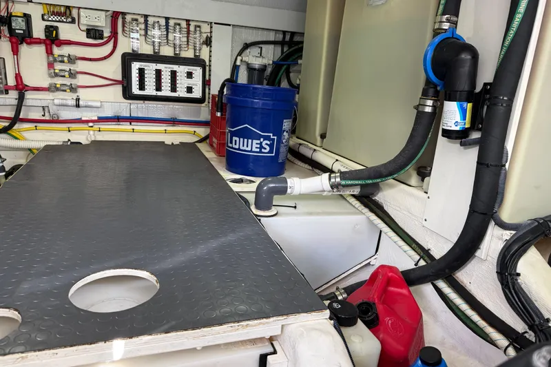 Slide: The Image of Engine room of 2017 Sabre 38 Salon Express with wiring, hoses, and equipment. - 82