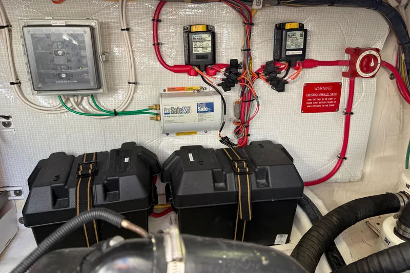 Slide: The Image of Engine room of 2017 Sabre 38 Salon Express with electrical components and battery boxes. - 83