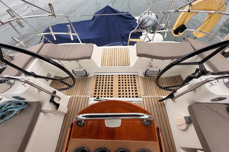 Slide: The Image of Cockpit of 2014 Jeanneau Sun Odyssey 50 DS with dual steering wheels and teak flooring. - 27