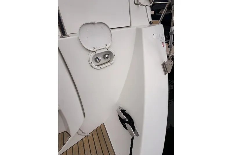 Slide: The Image of 2014 Jeanneau Sun Odyssey 50 DS yacht deck with open hatch and mooring cleat. - 28