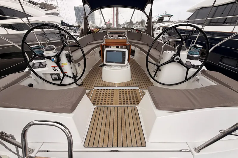 Slide: The Image of Cockpit of 2014 Jeanneau Sun Odyssey 50 DS sailboat with dual steering wheels. - 29