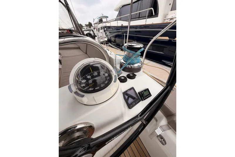 Slide: The Image of Cockpit view of 2014 Jeanneau Sun Odyssey 50 DS sailboat with compass and navigation instruments. - 31