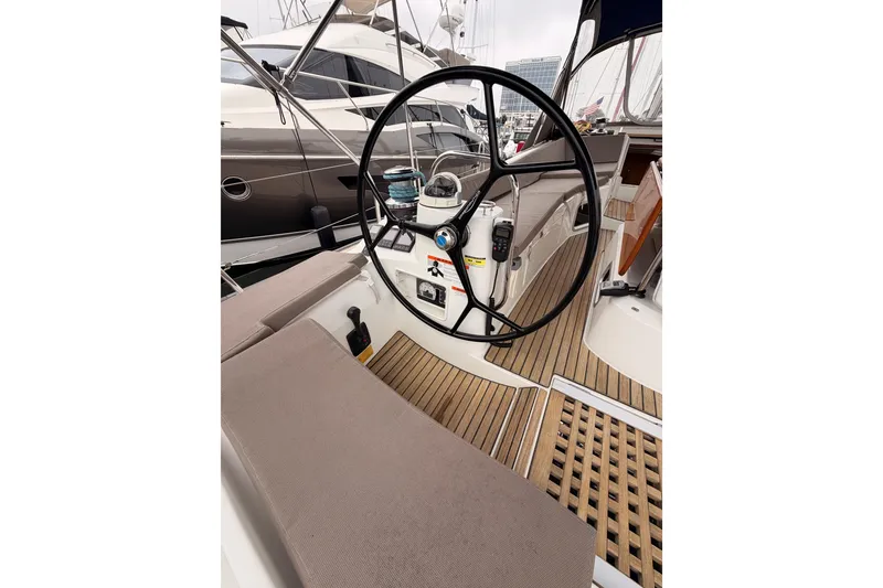 Slide: The Image of Cockpit of 2014 Jeanneau Sun Odyssey 50 DS sailboat with steering wheel and teak flooring. - 32