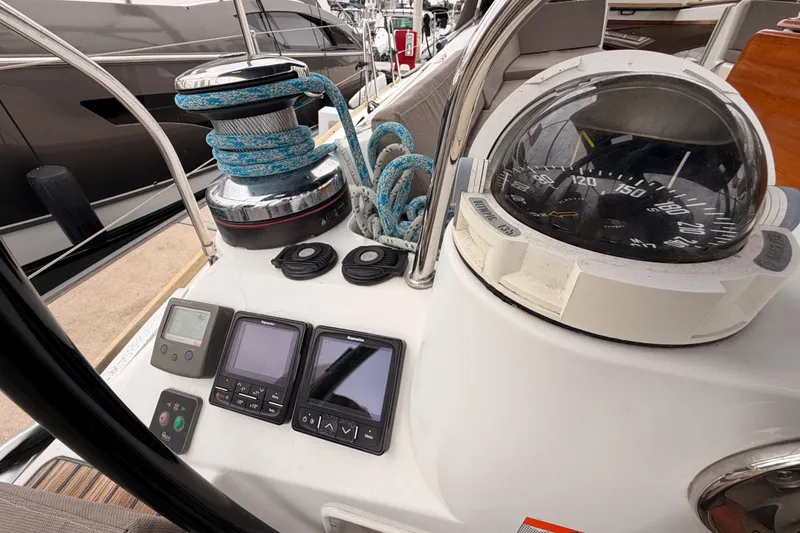 Slide: The Image of Cockpit of 2014 Jeanneau Sun Odyssey 50 DS with navigation instruments and compass. - 34