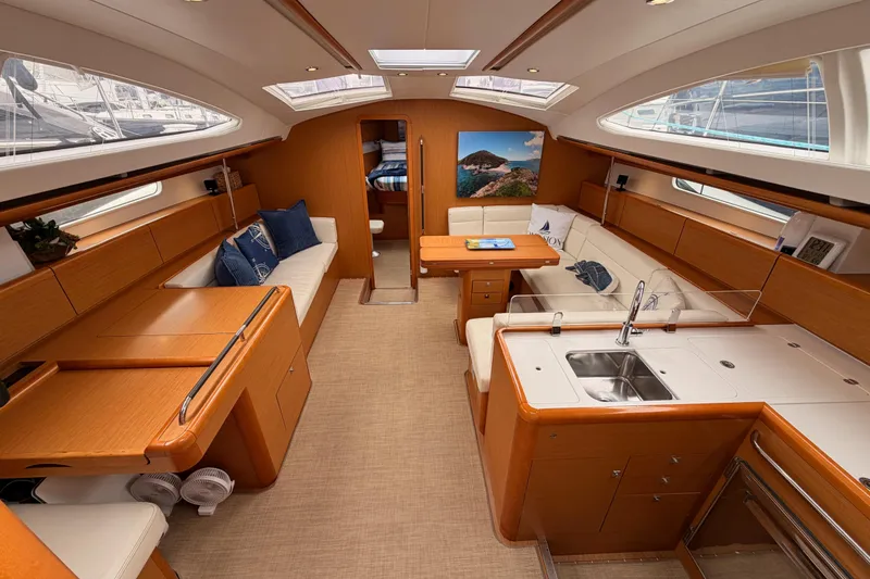 Slide: The Image of Luxurious interior of 2014 Jeanneau Sun Odyssey 50 DS yacht, featuring elegant wood finishes. - 39