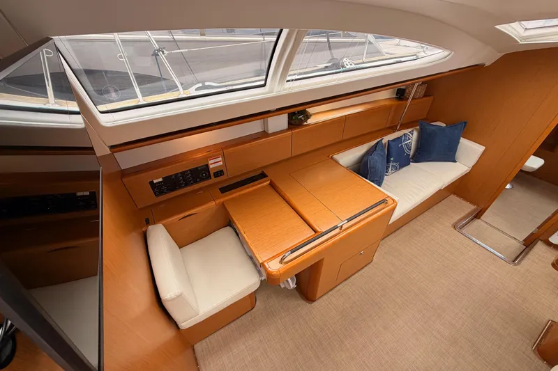 Slide: The Image of Luxurious interior of 2014 Jeanneau Sun Odyssey 50 DS yacht with elegant seating and wooden finishes. - 41