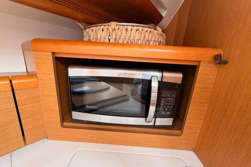 Slide: The Image of Microwave in Jeanneau Sun Odyssey 50 DS yacht kitchen, 2014 model. - 47