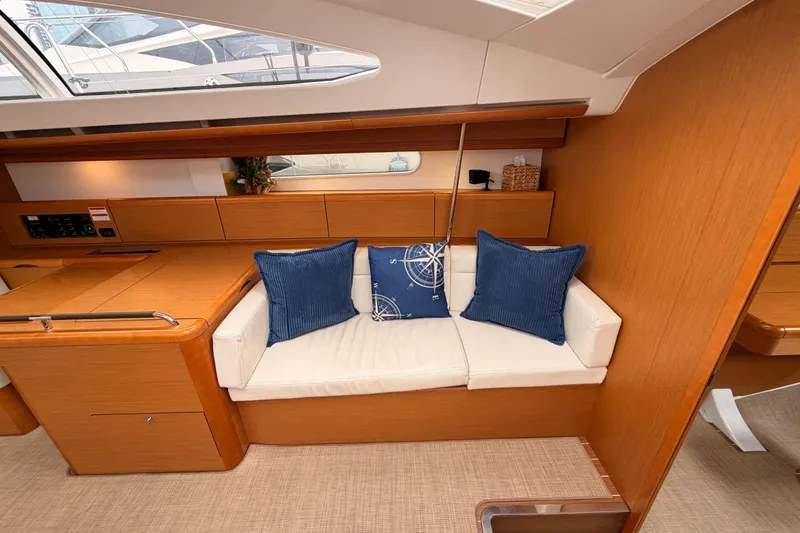Slide: The Image of Interior of 2014 Jeanneau Sun Odyssey 50 DS yacht with cozy seating and nautical decor. - 57