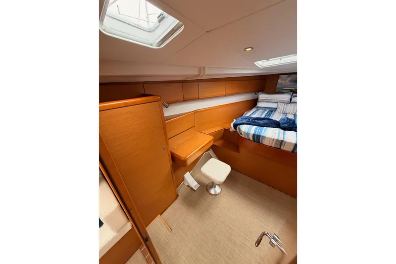 Slide: The Image of Luxurious interior of 2014 Jeanneau Sun Odyssey 50 DS yacht cabin with bed and seating. - 59