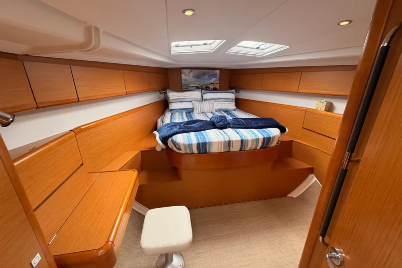 Slide: The Image of Luxurious cabin interior of 2014 Jeanneau Sun Odyssey 50 DS yacht with cozy bedding. - 60