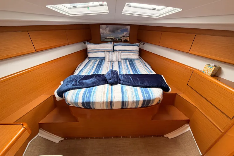 Slide: The Image of Luxurious cabin interior of 2014 Jeanneau Sun Odyssey 50 DS sailboat with cozy bedding. - 61
