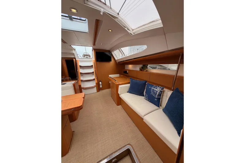 Slide: The Image of Interior of 2014 Jeanneau Sun Odyssey 50 DS yacht with elegant seating and modern design. - 68