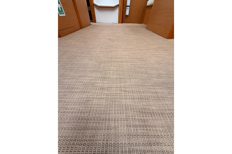 Slide: The Image of Interior view of 2014 Jeanneau Sun Odyssey 50 DS, featuring woven flooring and wooden cabinetry. - 71