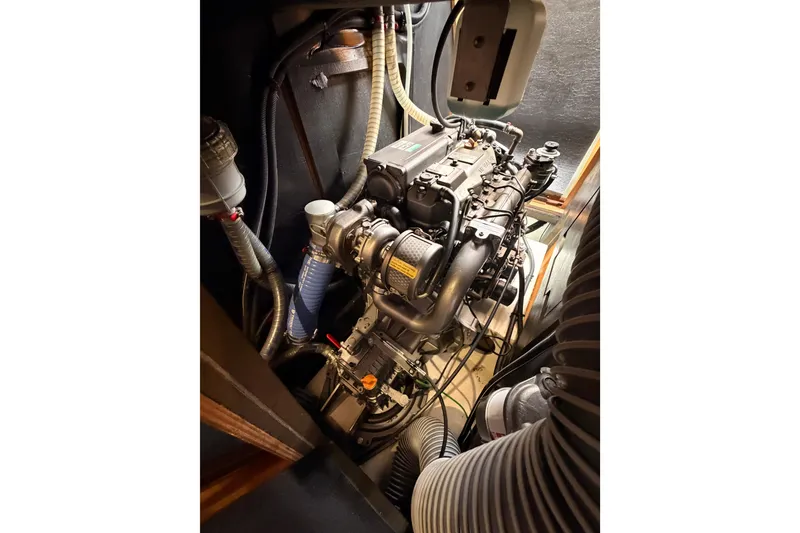 Slide: The Image of Engine compartment of 2014 Jeanneau Sun Odyssey 50 DS sailboat, showcasing detailed mechanical components. - 75