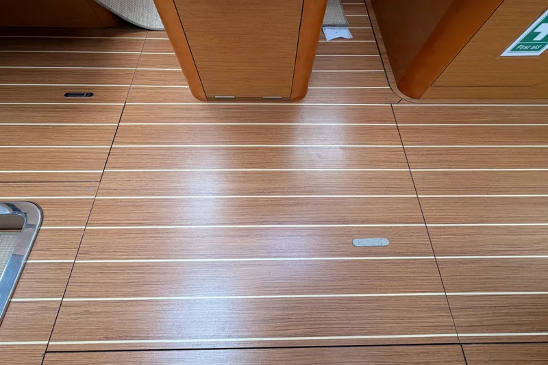 Slide: The Image of Teak flooring on 2014 Jeanneau Sun Odyssey 50 DS yacht interior. - 76