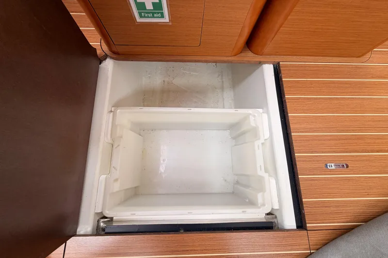 Slide: The Image of Storage compartment in 2014 Jeanneau Sun Odyssey 50 DS yacht interior, featuring wooden flooring. - 77