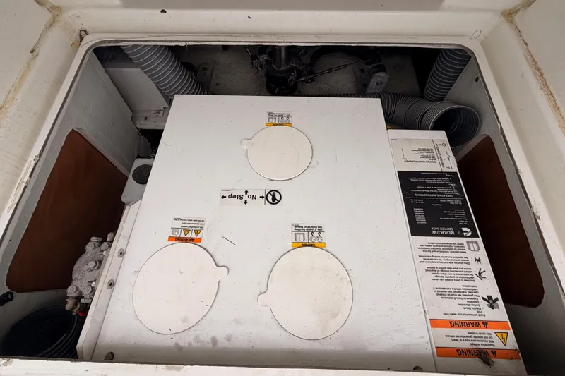 Slide: The Image of Engine compartment of a 2014 Jeanneau Sun Odyssey 50 DS sailboat, showing mechanical components. - 80