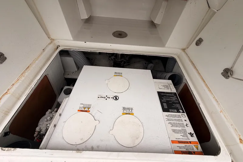 Slide: The Image of Engine compartment of 2014 Jeanneau Sun Odyssey 50 DS sailboat, showcasing mechanical components. - 84