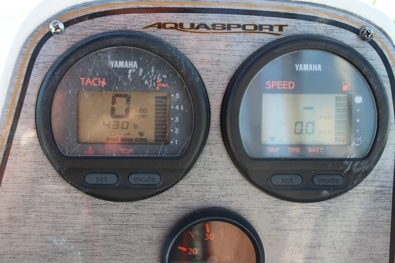 Slide: The Image of Dashboard of a 2003 Aquasport 215 Explorer with Yamaha tachometer and speedometer. - 6