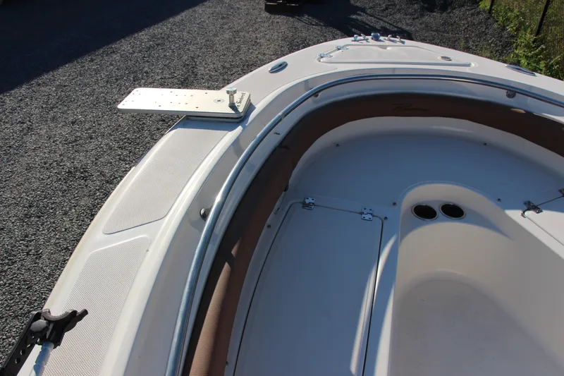 Slide: The Image of 2022 Pioneer 222 Islander boat interior with seating and storage compartments. - 11