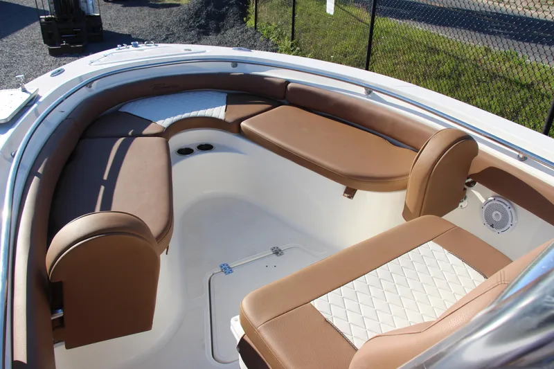 Slide: The Image of Luxurious seating area on 2022 Pioneer 222 Islander boat with brown cushions. - 6
