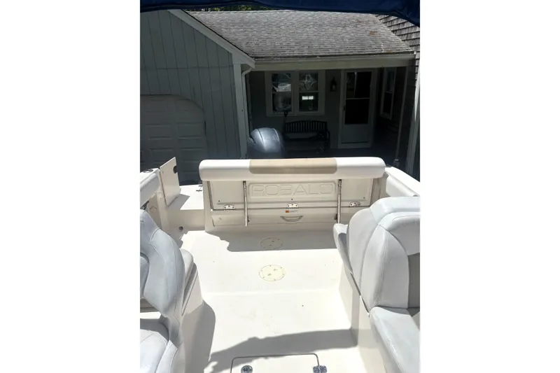 Slide: The Image of 2016 Robalo R227 Dual Console boat interior with seating and storage. - 16