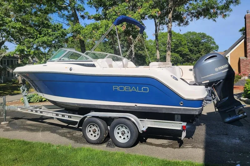 Slide: The Image of 2016 Robalo R227 Dual Console boat on trailer with Yamaha outboard motor. - 6