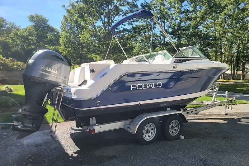Slide: The Image of 2016 Robalo R227 Dual Console boat on trailer with Yamaha outboard motor. - 7