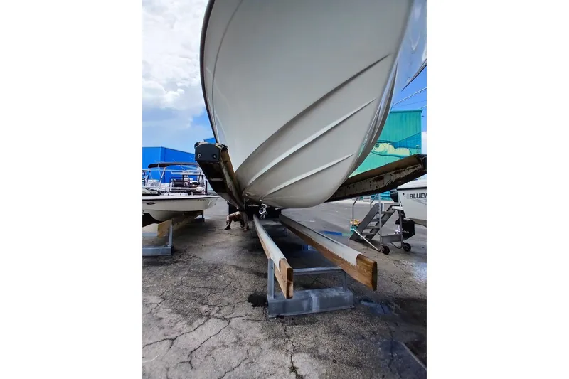 Slide: The Image of Grady-White Advance 247 boat on trailer, viewed from below, showcasing hull design. - 14