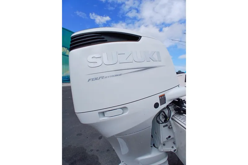 Slide: The Image of Suzuki four-stroke outboard motor on a 1996 Grady-White Advance 247 boat. - 16
