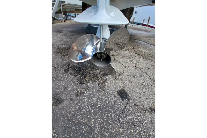 Slide: The Image of Propeller of 1996 Grady-White Advance 247 boat on cracked pavement background. - 24