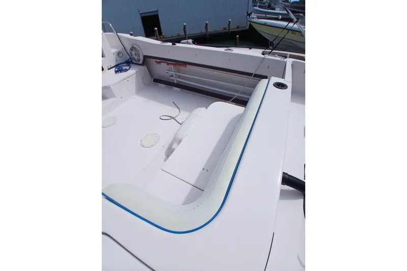 Slide: The Image of 1996 Grady-White Advance 247 boat interior with seating and storage compartments. - 26