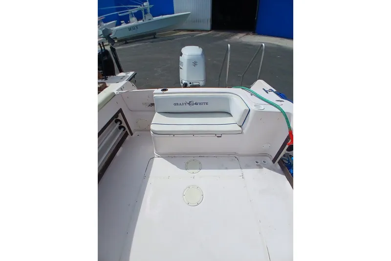 Slide: The Image of 1996 Grady-White Advance 247 boat interior with seating and motor view. - 28