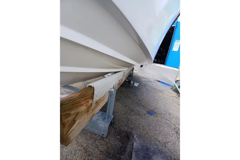 Slide: The Image of 1996 Grady-White Advance 247 boat hull on trailer, close-up view. - 35