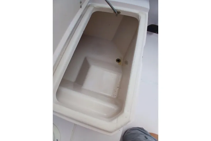 Slide: The Image of Open storage compartment on a 1996 Grady-White Advance 247 boat. - 36