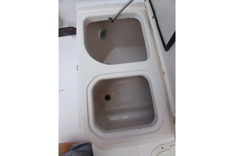 Slide: The Image of Dual sink setup on a 1996 Grady-White Advance 247 boat. - 37