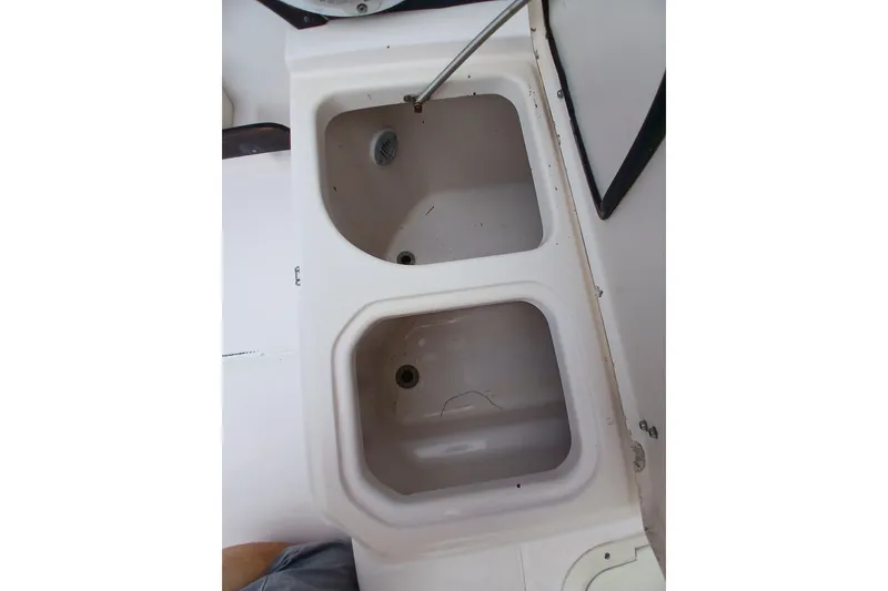 Slide: The Image of Dual sink setup on 1996 Grady-White Advance 247 boat interior. - 39