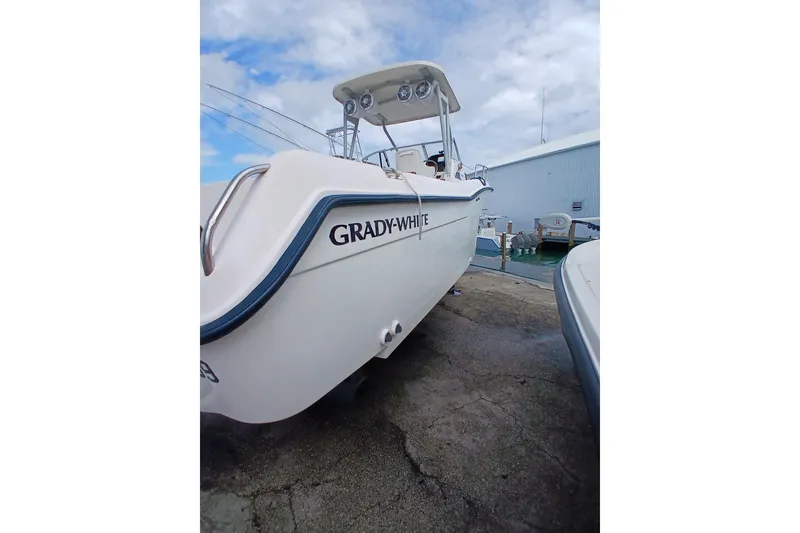 Slide: The Image of 1996 Grady-White Advance 247 boat docked, showcasing sleek design and sturdy build. - 40