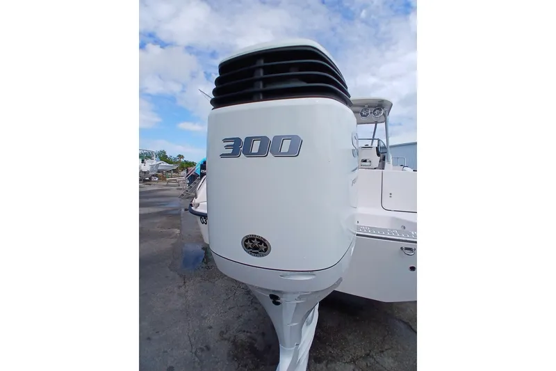 Slide: The Image of Outboard motor on a 1996 Grady-White Advance 247 boat, showcasing a 300 horsepower engine. - 42