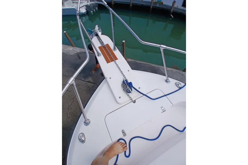 Slide: The Image of Bow of 1996 Grady-White Advance 247 boat with anchor and blue rope. - 43