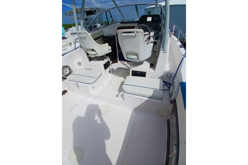 Slide: The Image of 1996 Grady-White Advance 247 boat interior with seating and steering wheel. - 7
