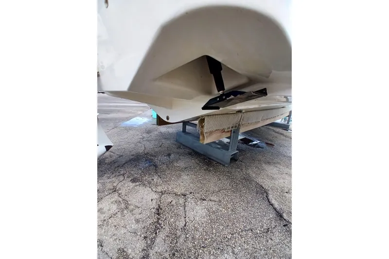 Slide: The Image of 1996 Grady-White Advance 247 boat hull on a stand, showing underside details. - 9