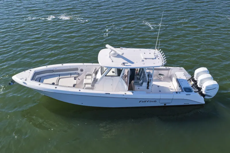 Slide: The Image of 2022 Everglades 365 Center Console boat cruising on open water. - 15